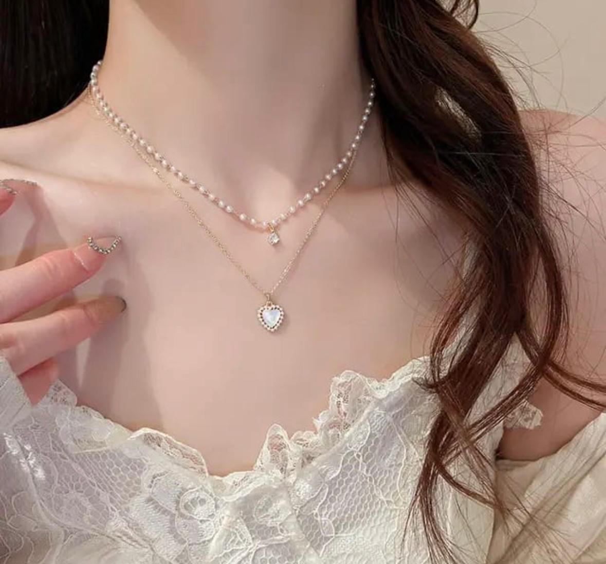 Adornity white stone heart shape necklace